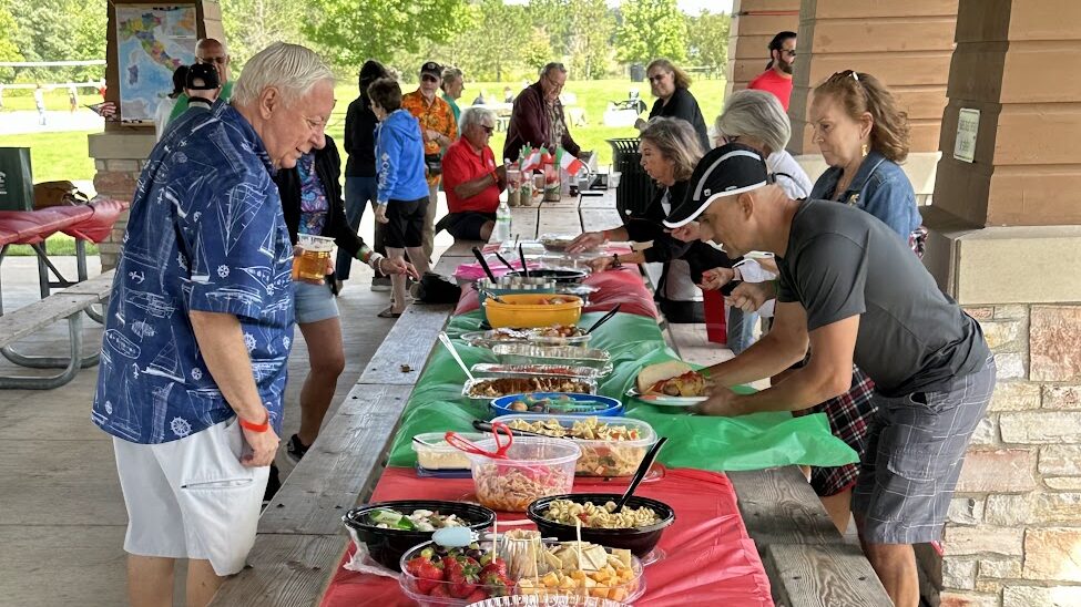 People eating at a picnic table